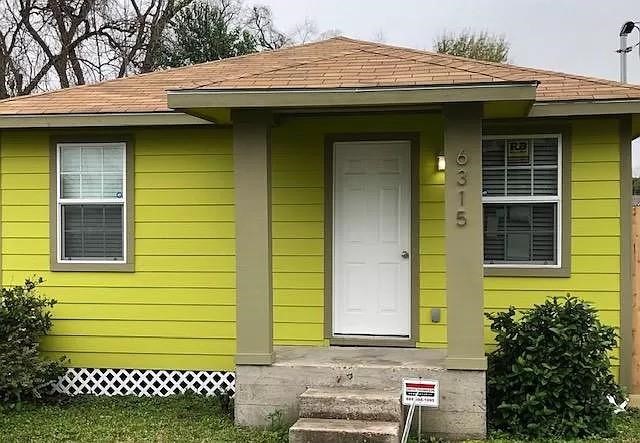 6315 Sayers Street Houston, TX 77026 - Photo 1 of 11 a front view of a house with a garden