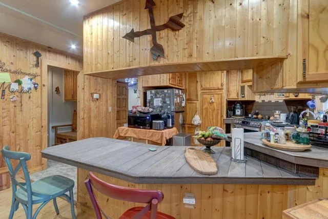 a kitchen with stainless steel appliances granite countertop a sink and cabinets