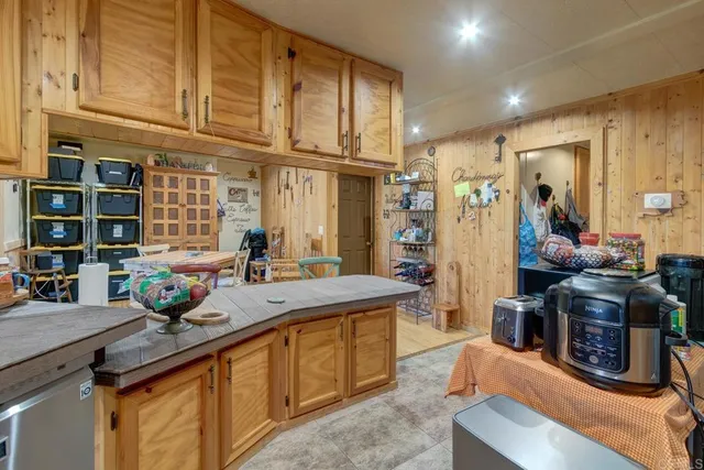 a kitchen with stainless steel appliances granite countertop a sink and cabinets