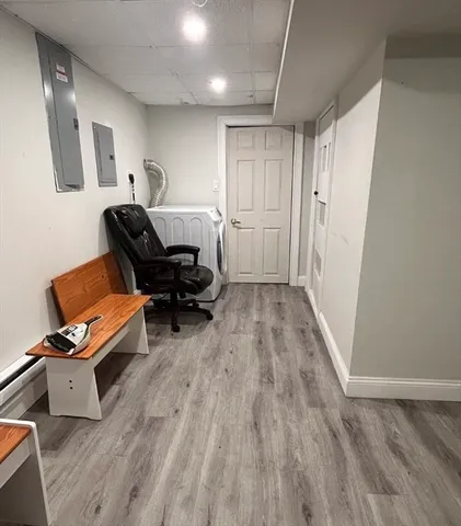 a room with furniture and wooden floor