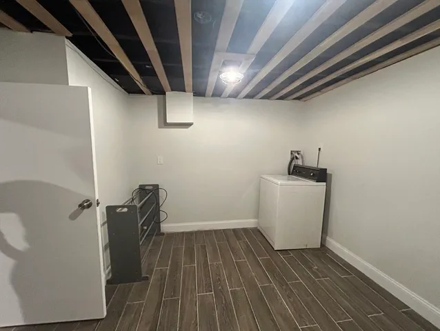 a view of a storage & utility room with wooden floor