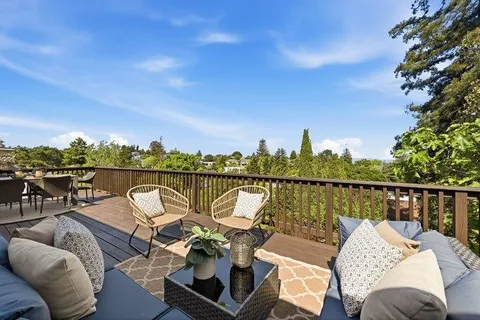 a view of a lake from balcony with seating space