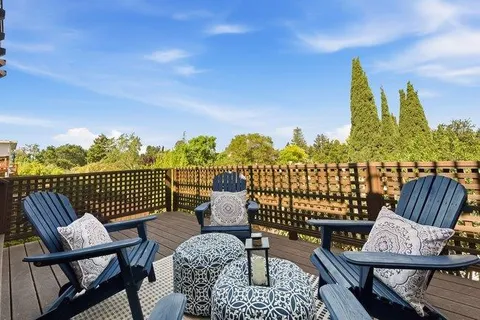 a view of a balcony with a chairs