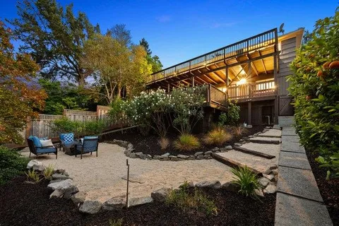 a backyard of a house with sitting area