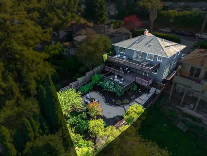 an aerial view of a house with a garden