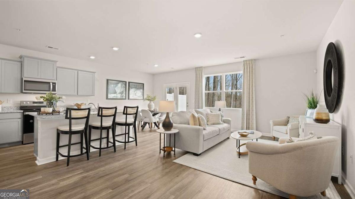 289 Sound Circle Stockbridge, GA 30281 - Photo 31 of 67 a living room with furniture and a flat screen tv