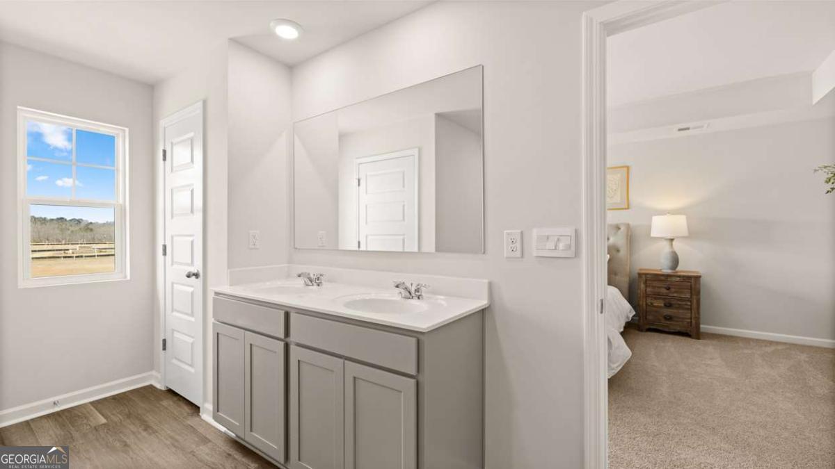 289 Sound Circle Stockbridge, GA 30281 - Photo 43 of 67 a bathroom with a sink and a mirror