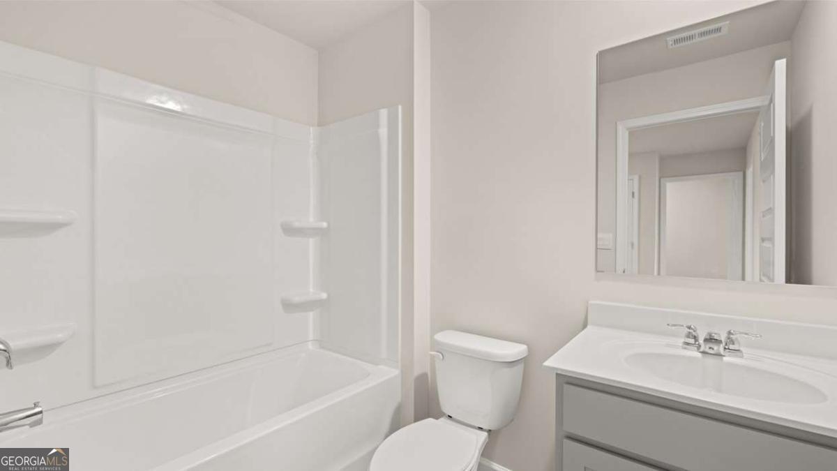 289 Sound Circle Stockbridge, GA 30281 - Photo 56 of 67 a bathroom with a sink toilet and shower