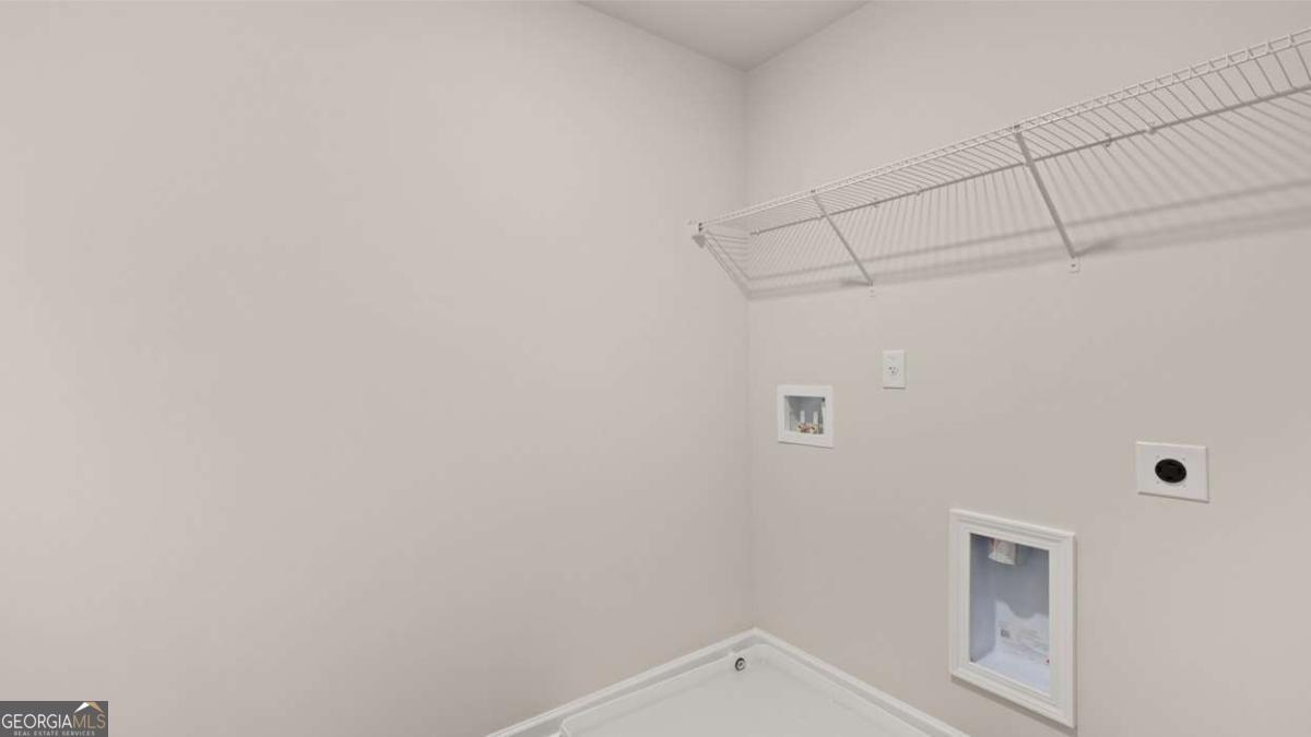 289 Sound Circle Stockbridge, GA 30281 - Photo 57 of 67 a view of a utility room with racks on the wall