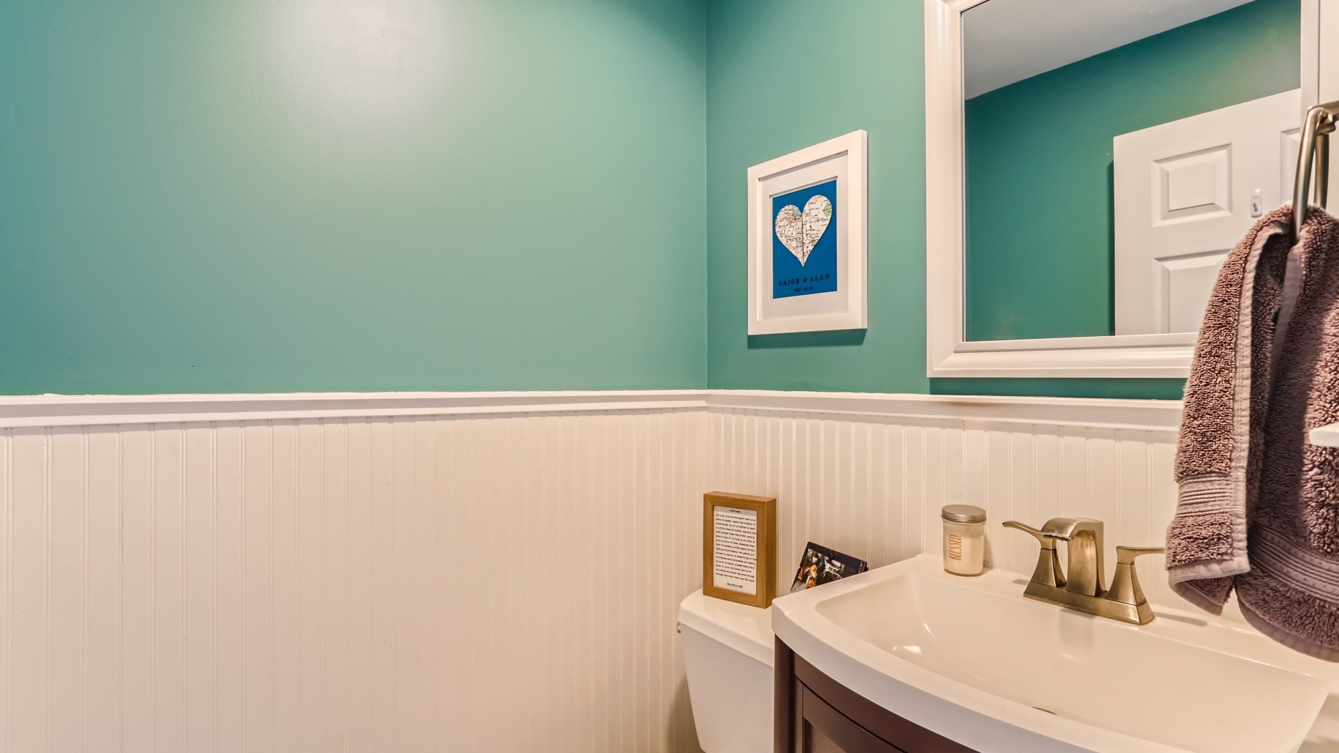 112 South Mt Prospect Road Mount Prospect, IL 60056 - Photo 12 of 27 a bathroom with a sink and a mirror