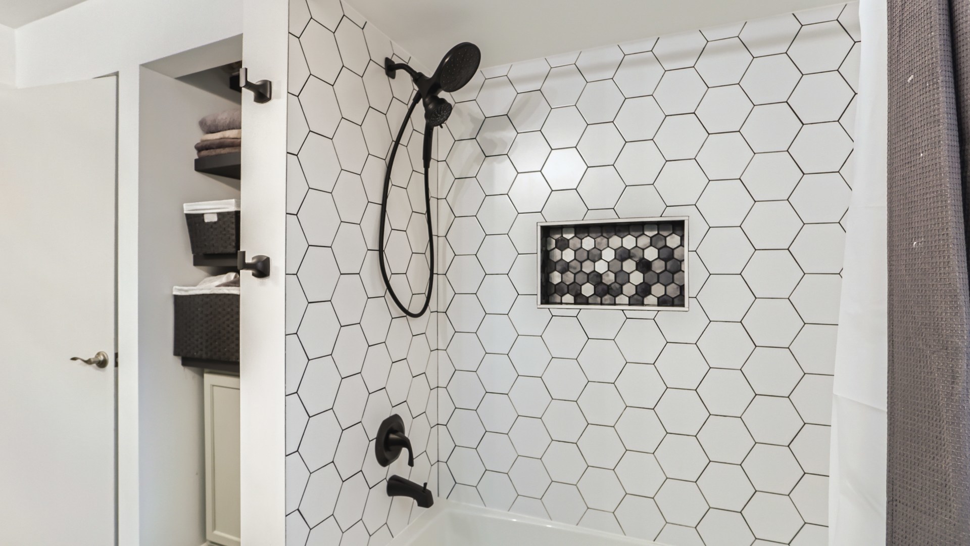 112 South Mt Prospect Road Mount Prospect, IL 60056 - Photo 16 of 27 a bathroom with a shower and a white bath tub