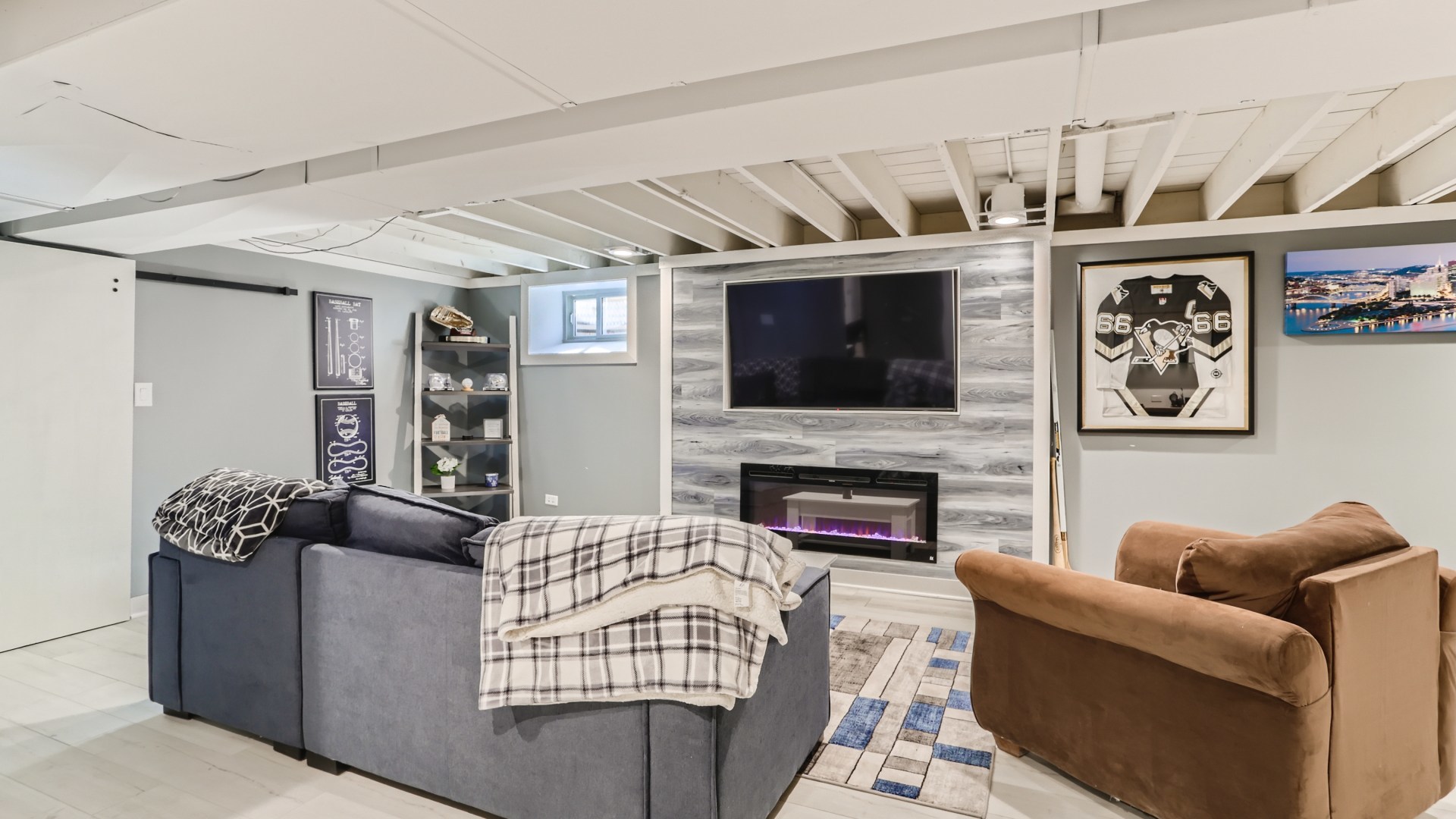 112 South Mt Prospect Road Mount Prospect, IL 60056 - Photo 19 of 27 a living room with furniture a flat screen tv and a fireplace