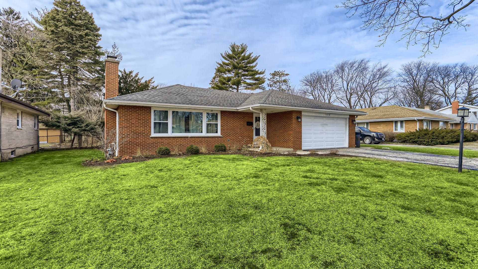 112 South Mt Prospect Road Mount Prospect, IL 60056 - Photo 2 of 27 a front view of house with yard and green space