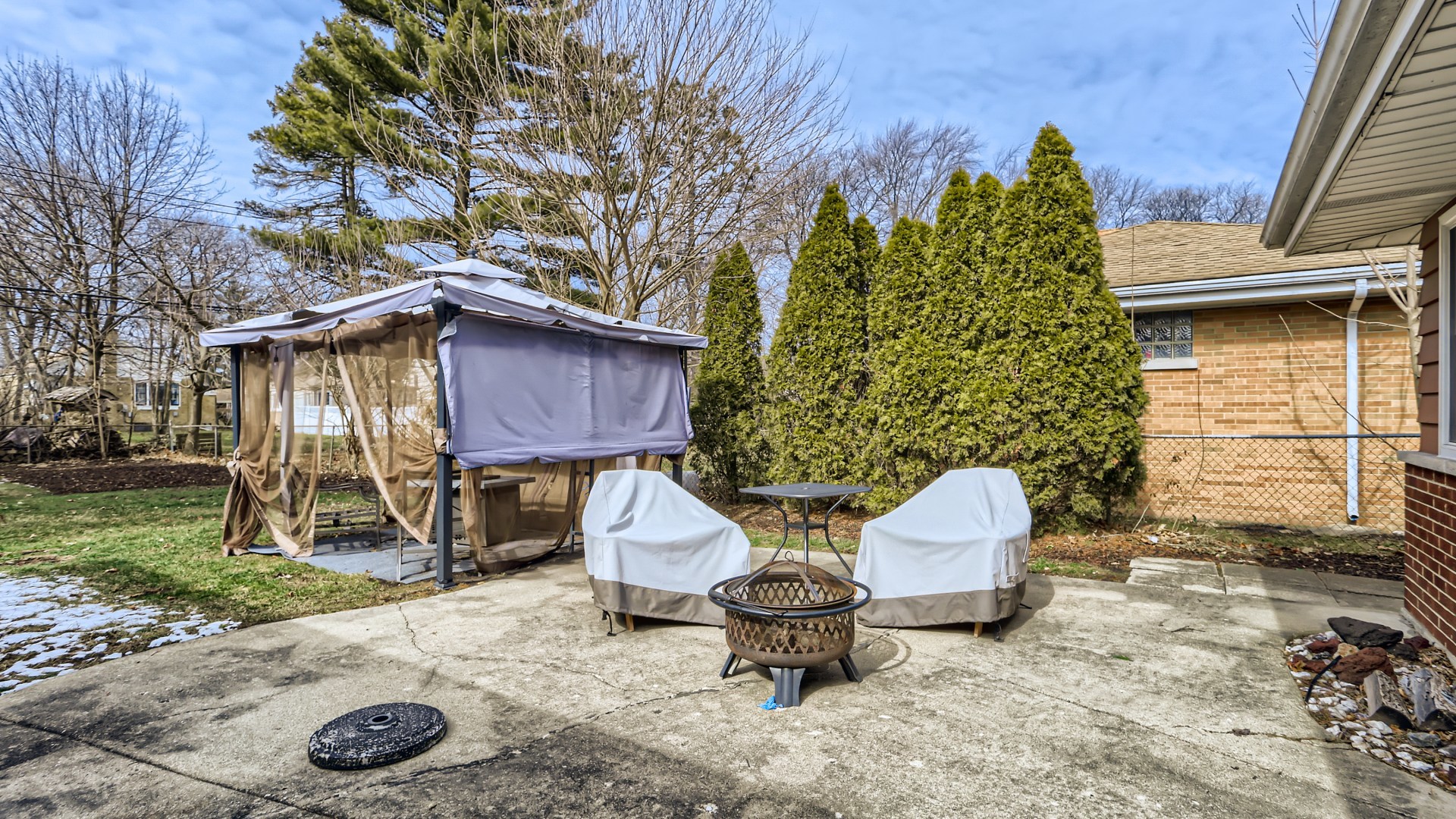 112 South Mt Prospect Road Mount Prospect, IL 60056 - Photo 25 of 27 a view of a backyard with furniture and a fire pit