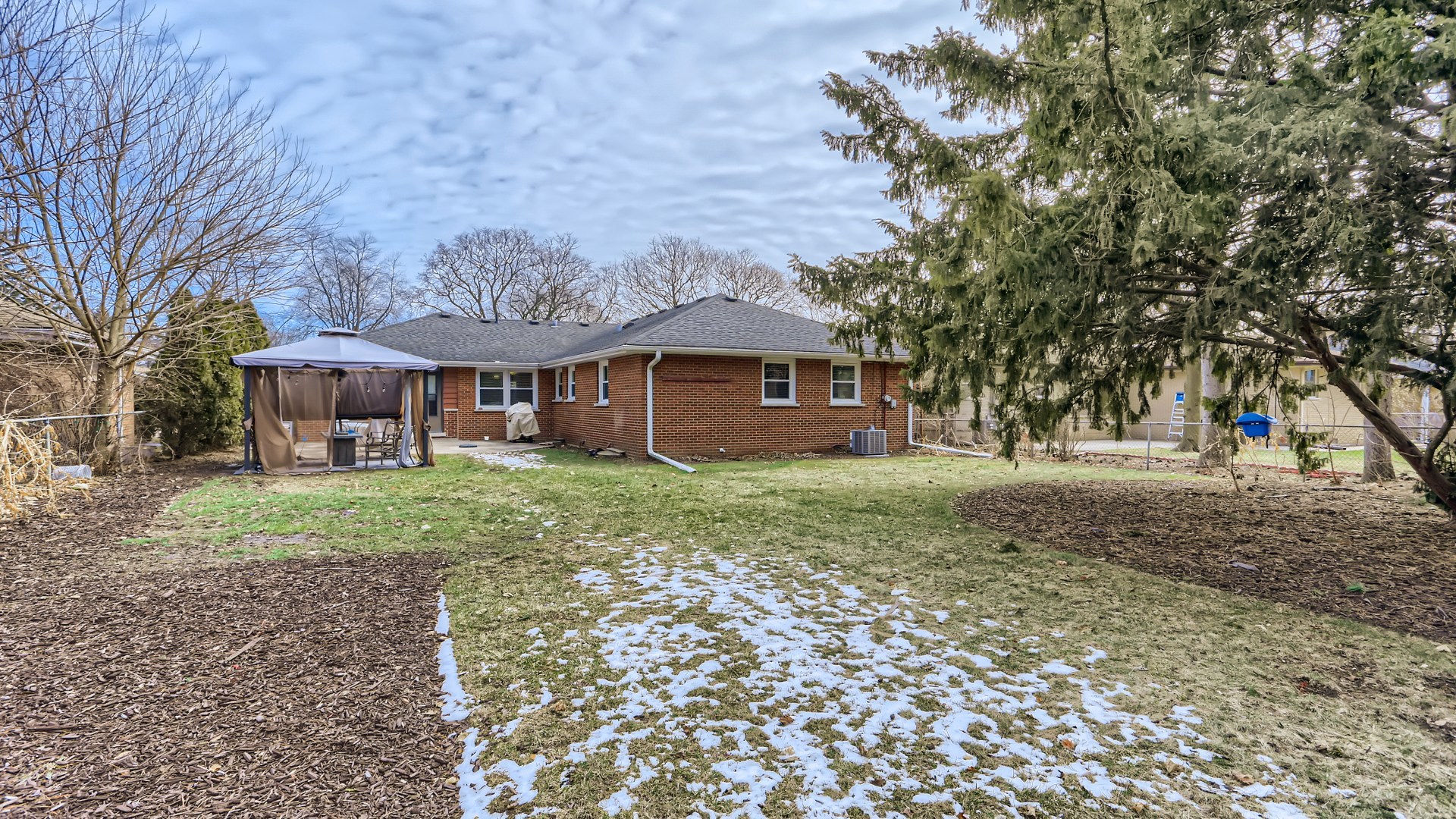 112 South Mt Prospect Road Mount Prospect, IL 60056 - Photo 27 of 27 a front view of a house with a garden