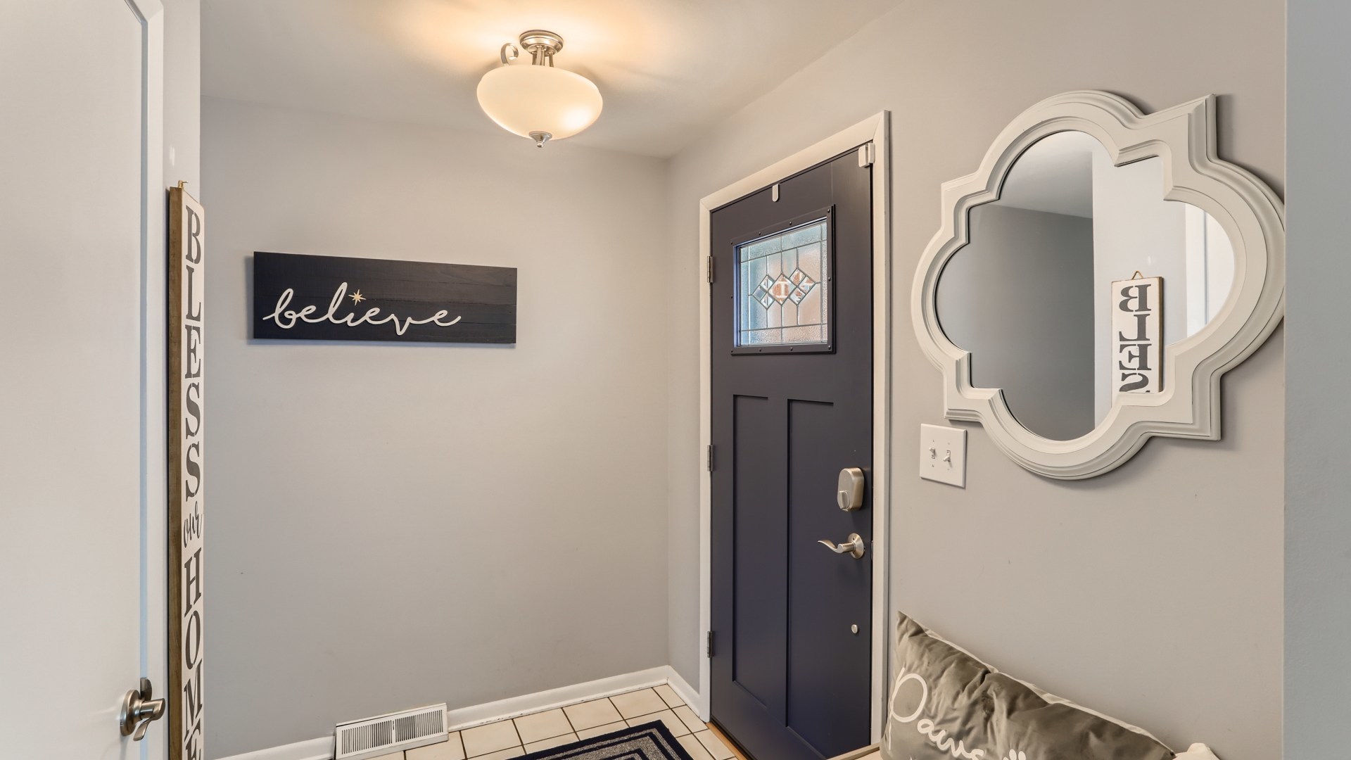 112 South Mt Prospect Road Mount Prospect, IL 60056 - Photo 4 of 27 a bathroom with a mirror and a shower