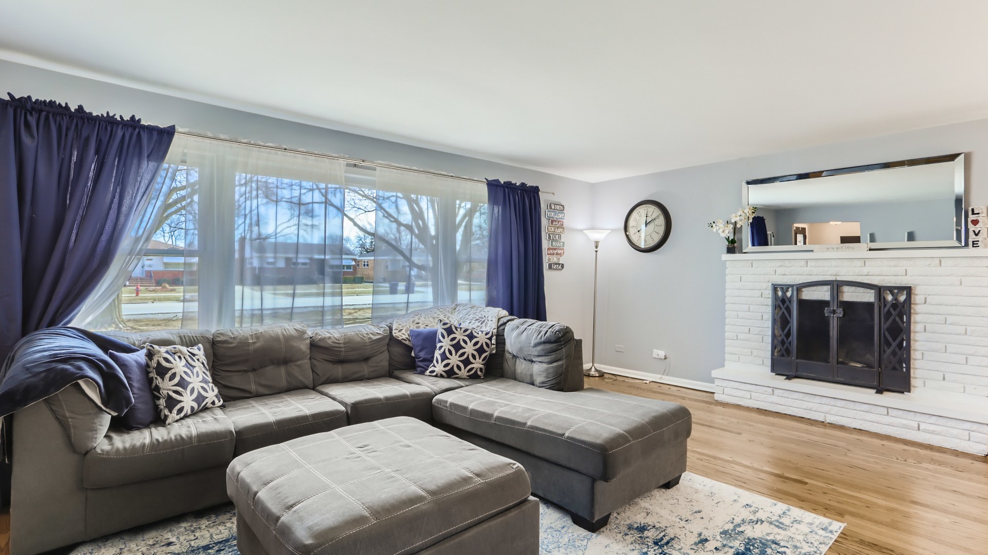112 South Mt Prospect Road Mount Prospect, IL 60056 - Photo 5 of 27 a living room with furniture and a fireplace