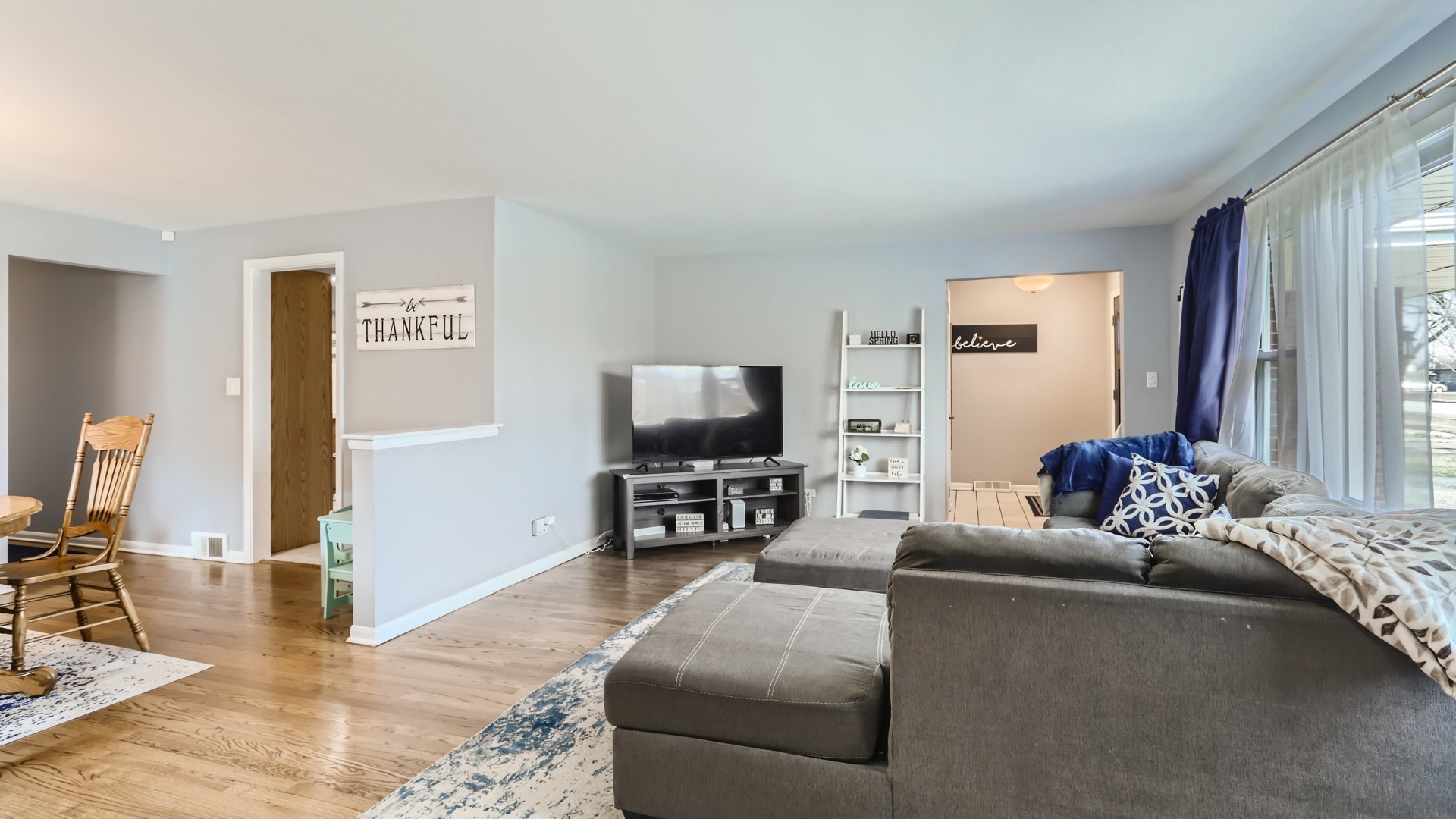 112 South Mt Prospect Road Mount Prospect, IL 60056 - Photo 6 of 27 a living room with furniture and a flat screen tv