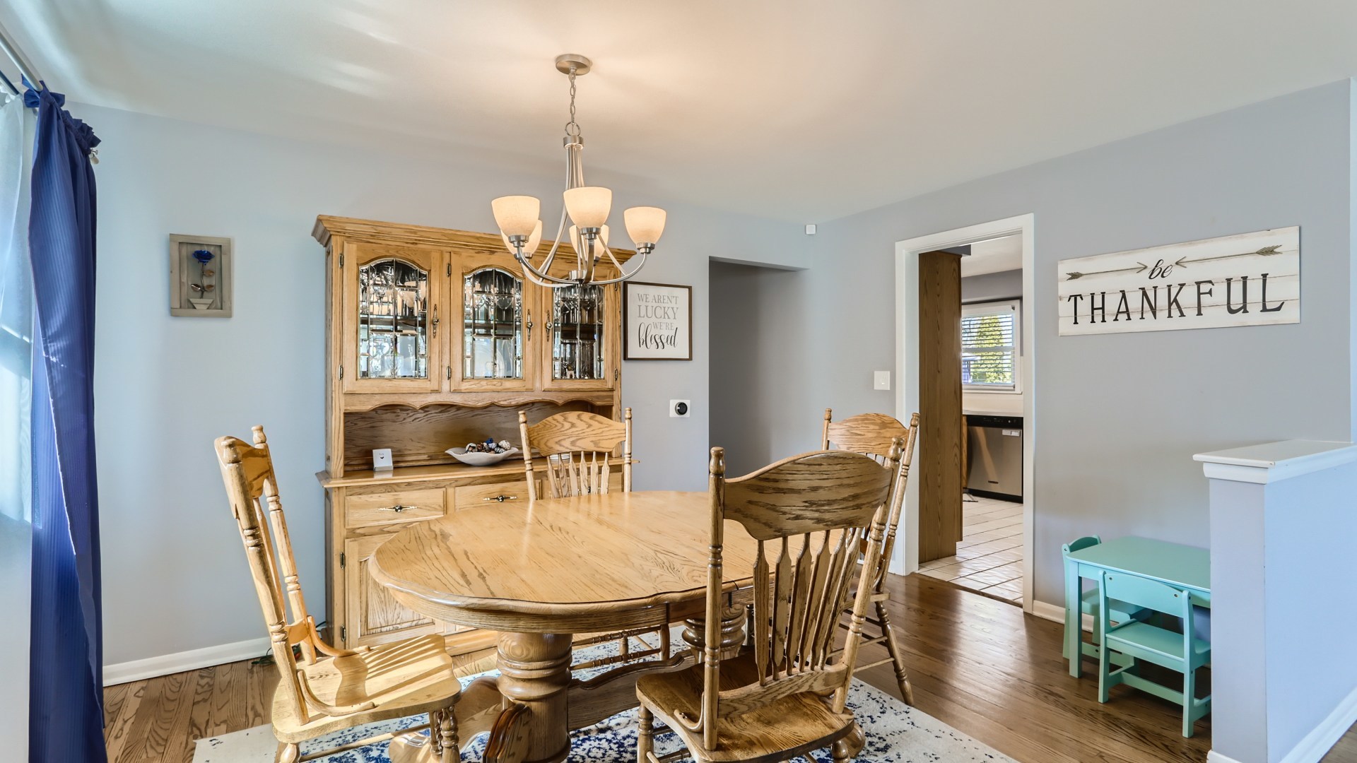 112 South Mt Prospect Road Mount Prospect, IL 60056 - Photo 7 of 27 a view of a dining room with furniture and chandelier