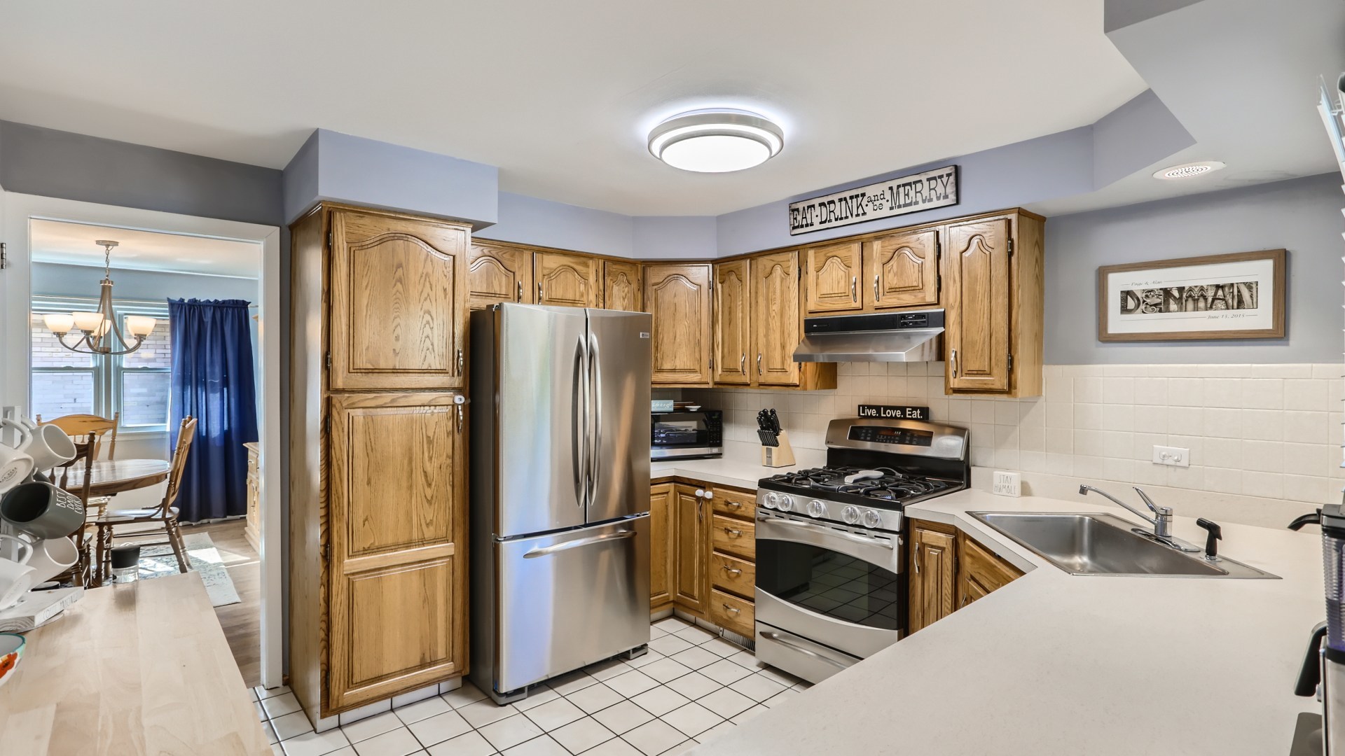 112 South Mt Prospect Road Mount Prospect, IL 60056 - Photo 8 of 27 a kitchen with stainless steel appliances granite countertop a refrigerator stove and sink
