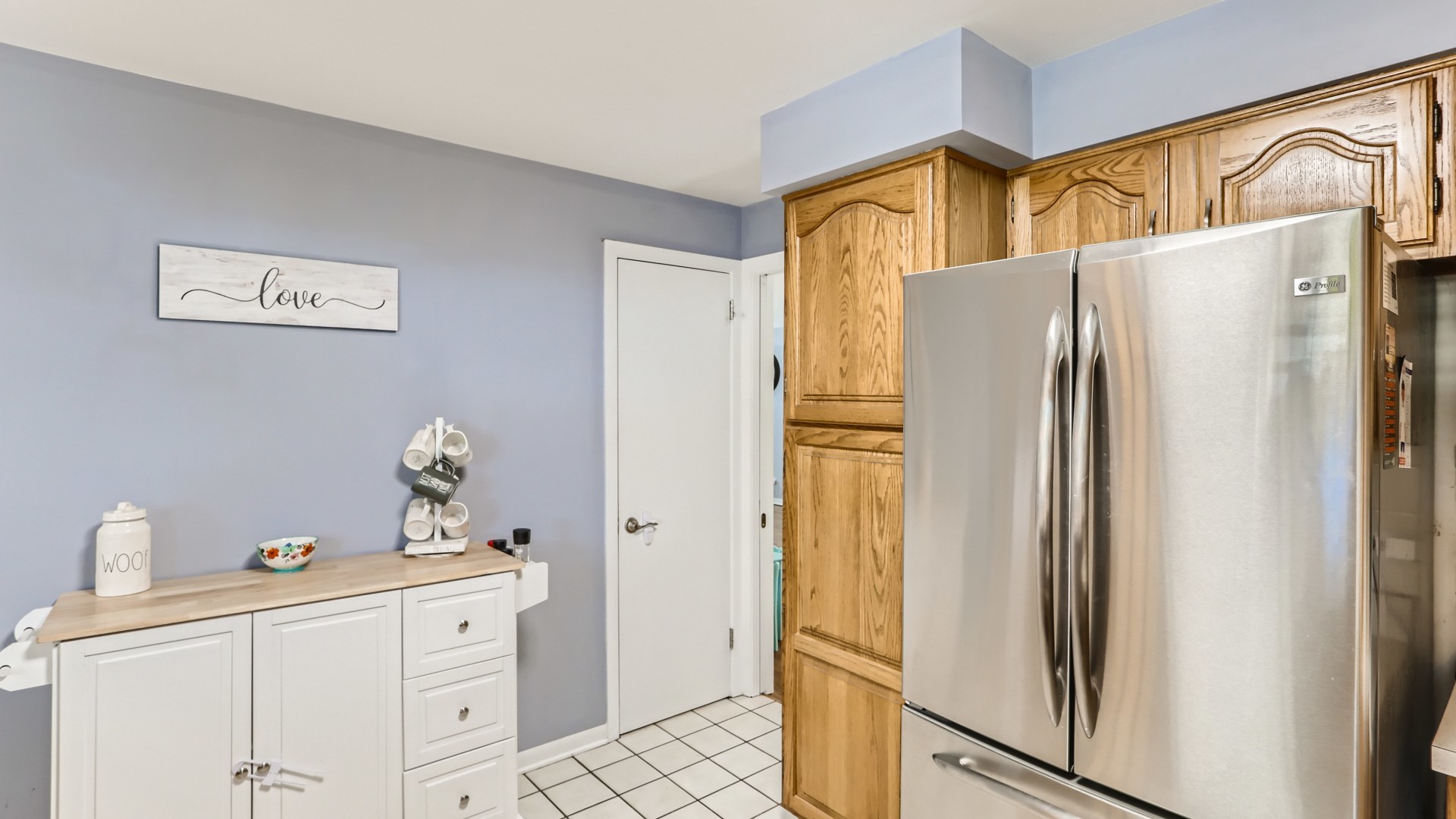112 South Mt Prospect Road Mount Prospect, IL 60056 - Photo 10 of 27 a white refrigerator freezer sitting inside of a kitchen