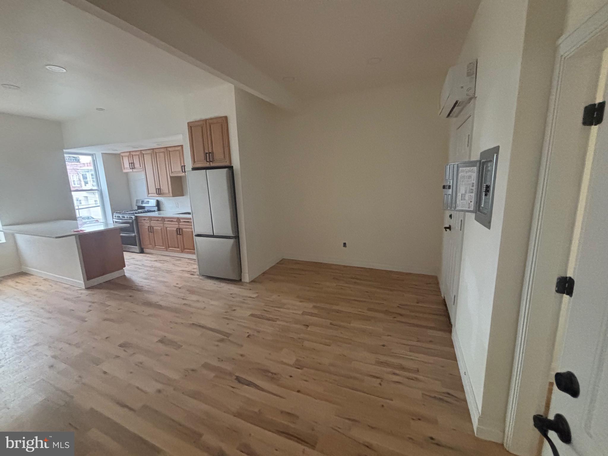 1120 Elm Street, Unit 2F Reading, PA 19604 - Photo 2 of 15 a view of empty room with wooden floor and window