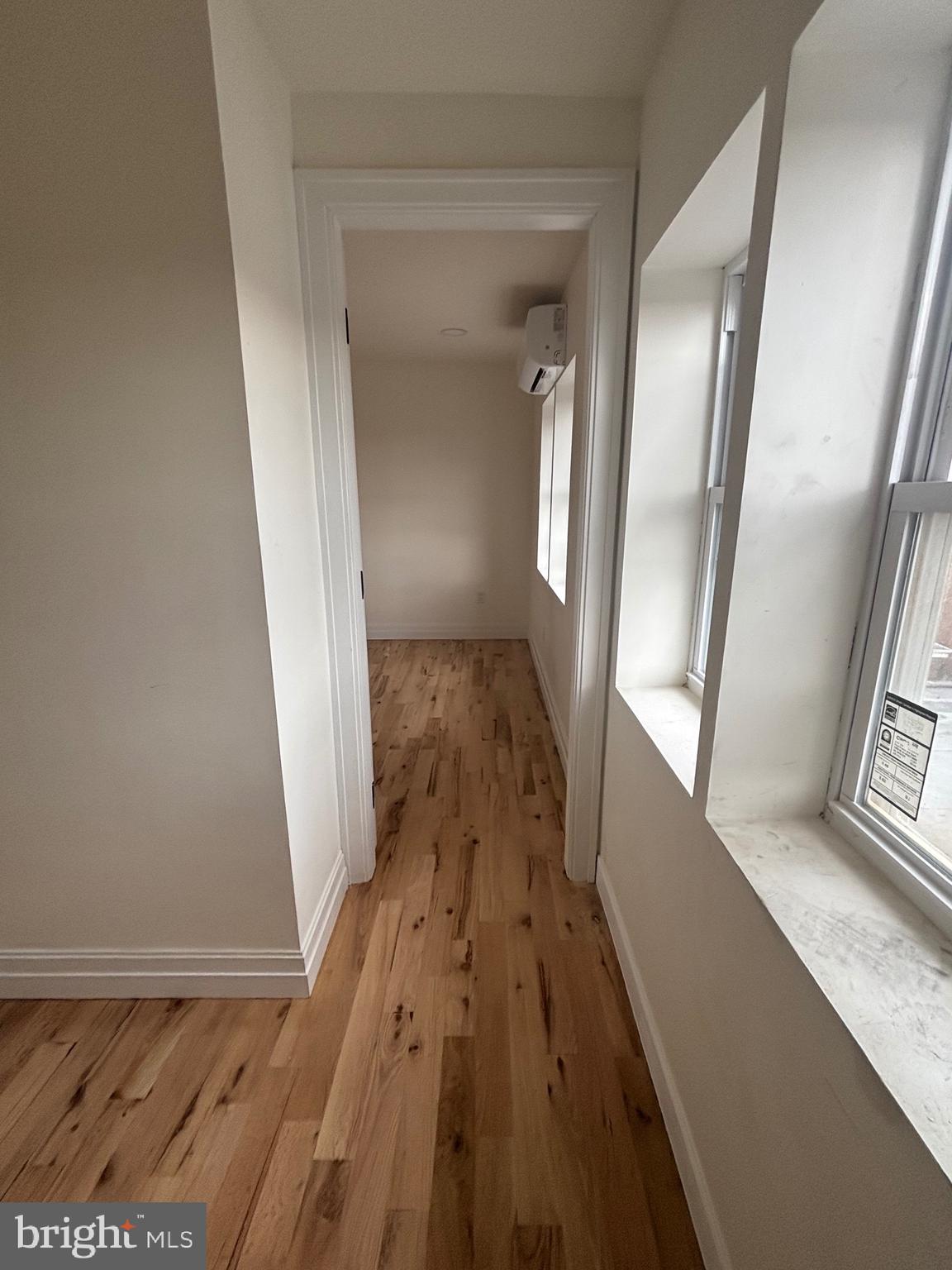 1120 Elm Street, Unit 2F Reading, PA 19604 - Photo 10 of 15 a view of a hallway with wooden floor and staircase