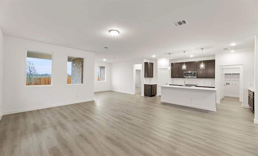 1005 Colgate Circle Princeton, TX 75407 - Photo 19 of 40 a view of kitchen with kitchen island stainless steel appliances refrigerator oven and cabinets