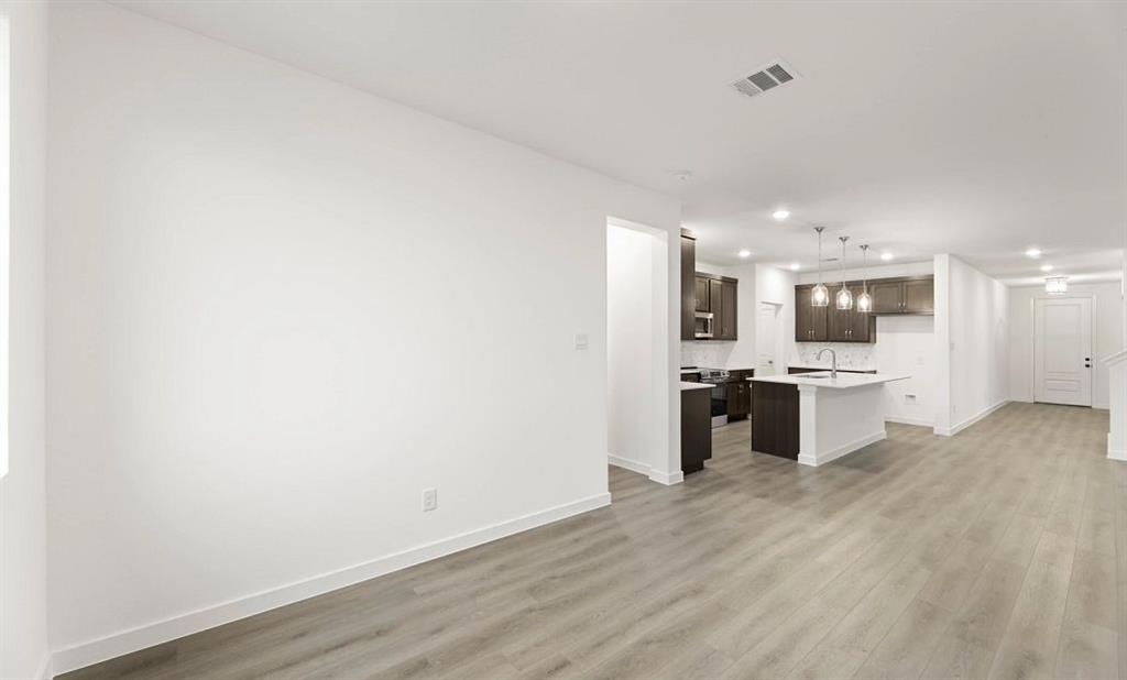 1005 Colgate Circle Princeton, TX 75407 - Photo 31 of 40 a view of a kitchen with a sink and cabinets