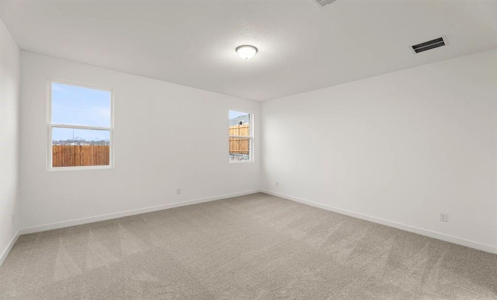 1005 Colgate Circle Princeton, TX 75407 - Photo 34 of 40 an empty room with windows