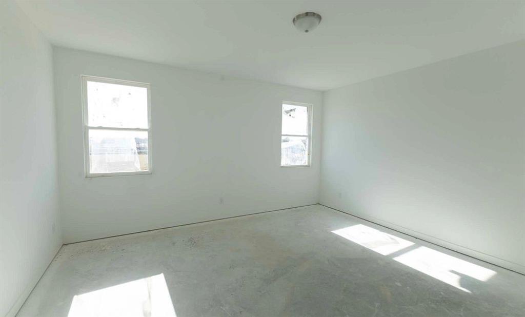 1005 Colgate Circle Princeton, TX 75407 - Photo 6 of 40 a view of empty room with windows