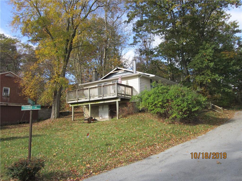 a house with trees in the background