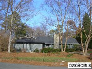 7147 Ramsgate Road Charlotte, NC 28270 - Photo 1 of 8 a view of a large white house with a yard