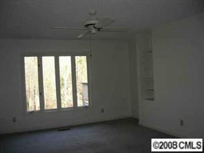 7147 Ramsgate Road Charlotte, NC 28270 - Photo 5 of 8 an empty room with a window