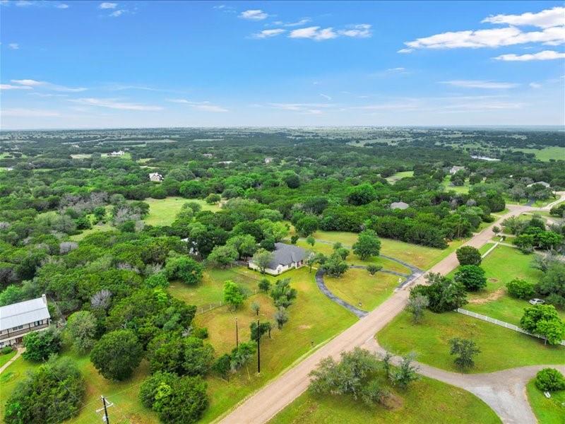 1072 Chapman Road Crawford, TX 76638 - Photo 39 of 39 an aerial view of residential houses with outdoor space and trees