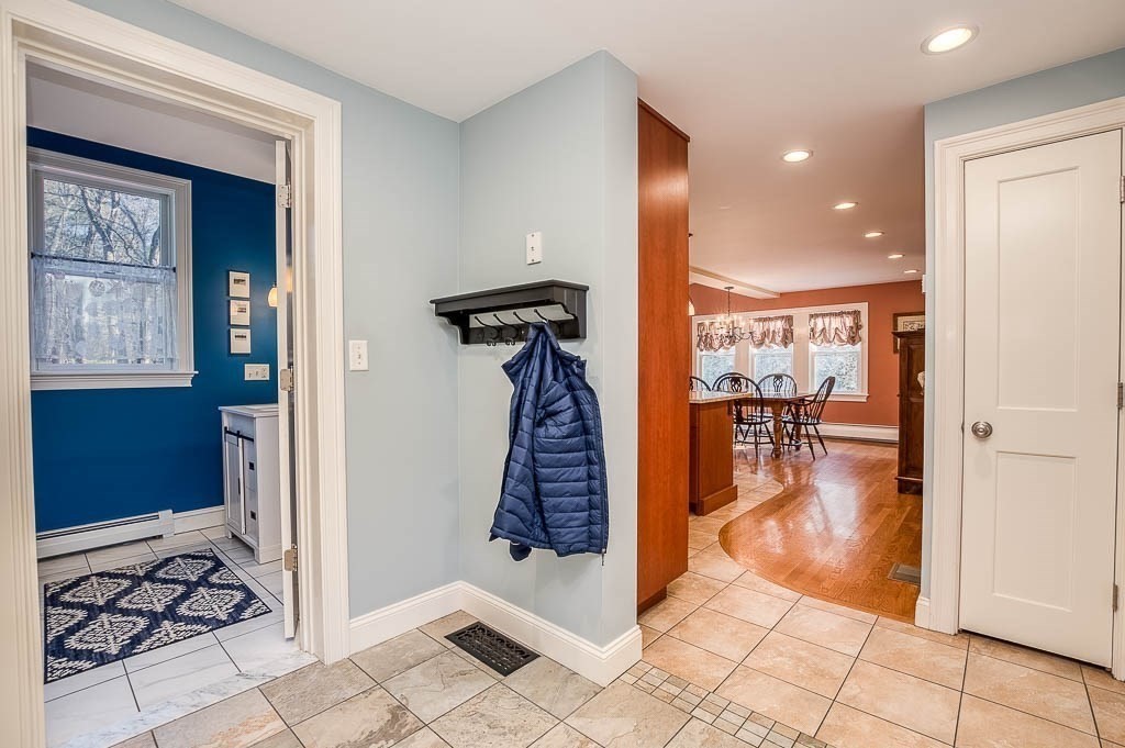 41 Millbrook Road Westwood, MA 02090 - Photo 13 of 42 a view of a hallway with wooden floor and a living room