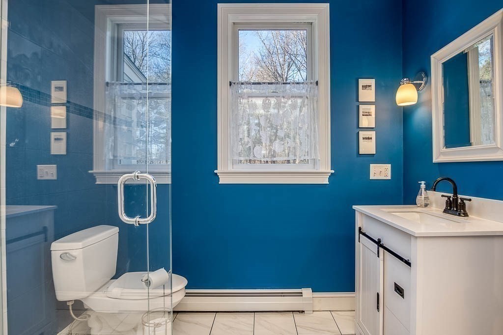 41 Millbrook Road Westwood, MA 02090 - Photo 14 of 42 a bathroom with a sink a toilet and mirror