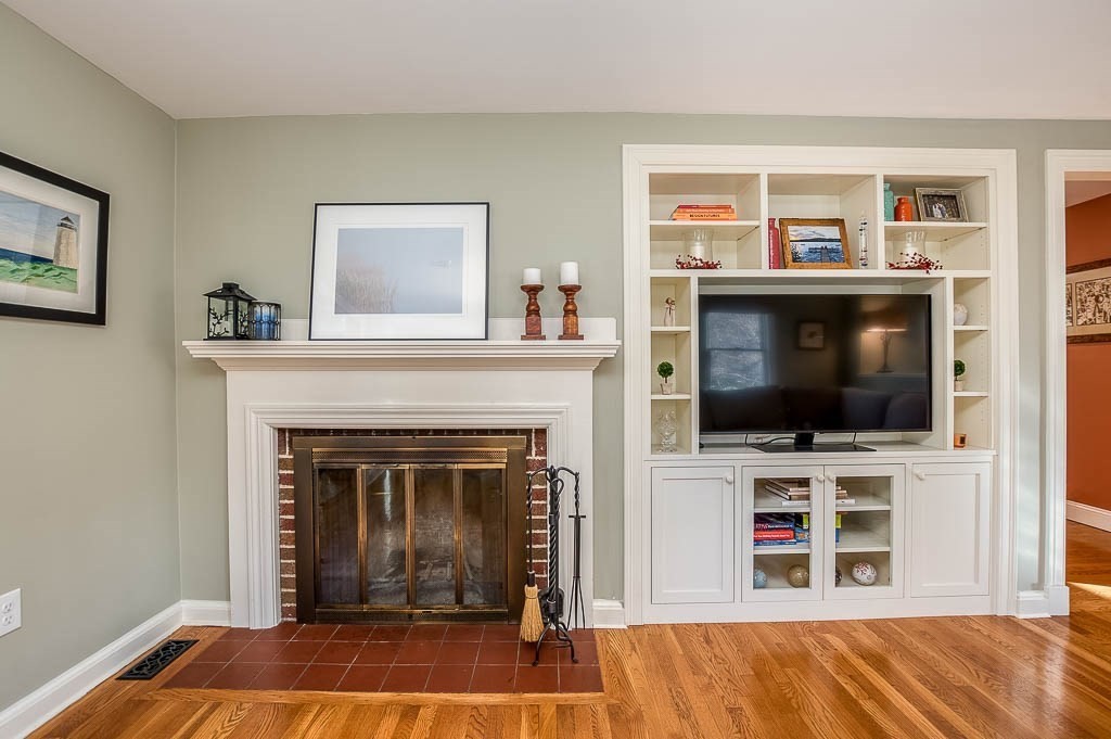 41 Millbrook Road Westwood, MA 02090 - Photo 18 of 42 a living room with a flat screen tv and a fireplace