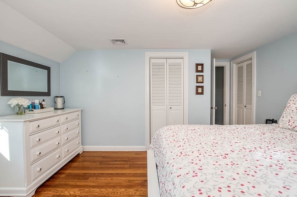 41 Millbrook Road Westwood, MA 02090 - Photo 25 of 42 a room with a bed and a mirror