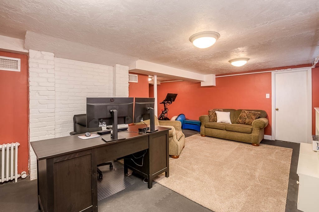41 Millbrook Road Westwood, MA 02090 - Photo 30 of 42 a livingroom with workspace and a couch