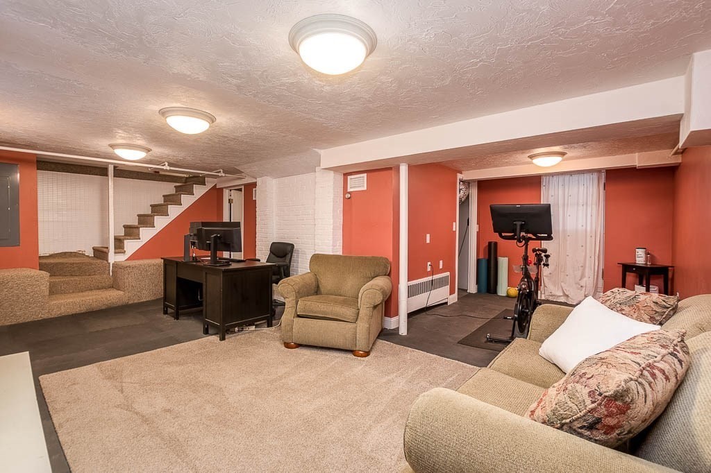 41 Millbrook Road Westwood, MA 02090 - Photo 31 of 42 a living room with furniture and a wooden floor