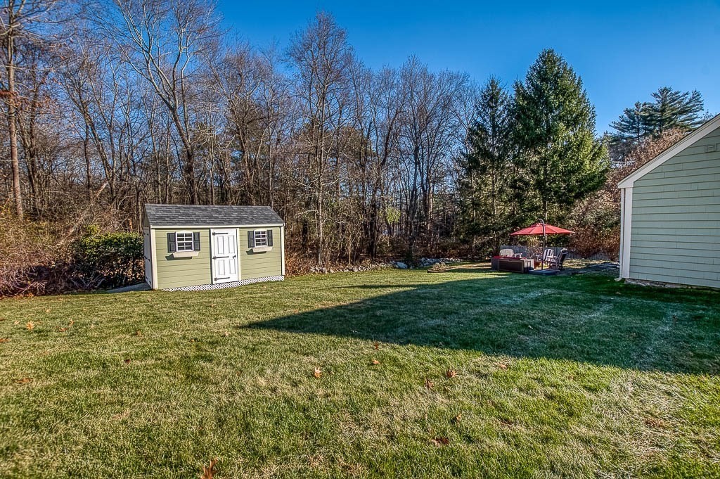 41 Millbrook Road Westwood, MA 02090 - Photo 36 of 42 a view of a yard in front of a house with large trees
