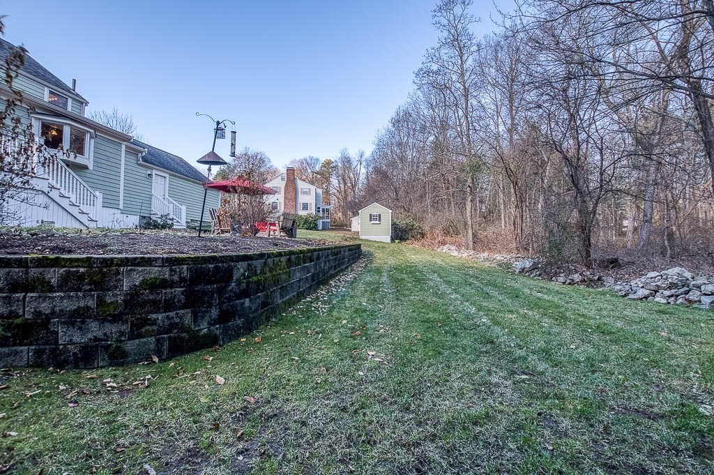 41 Millbrook Road Westwood, MA 02090 - Photo 39 of 42 a view of a house with a backyard and a yard