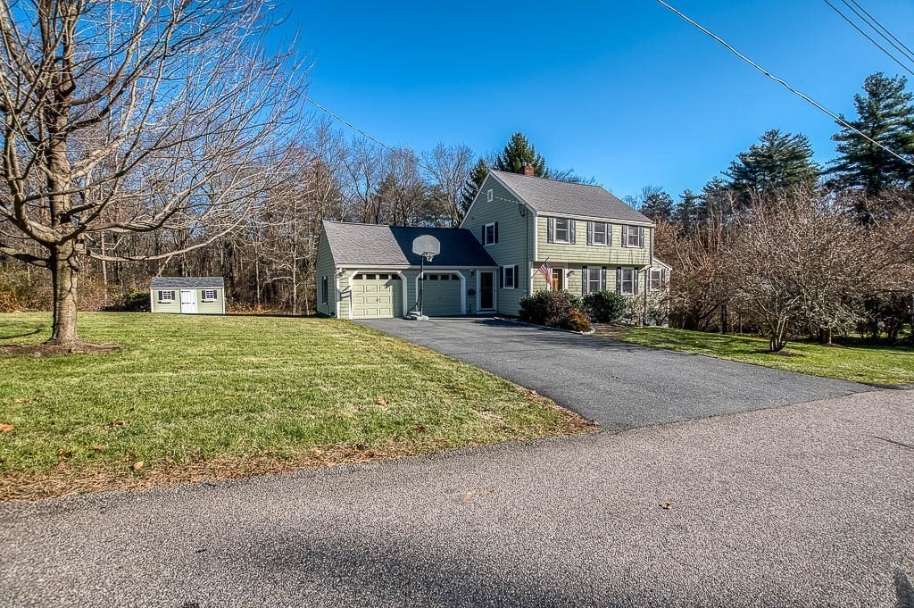 41 Millbrook Road Westwood, MA 02090 - Photo 4 of 42 a front view of a house with a yard