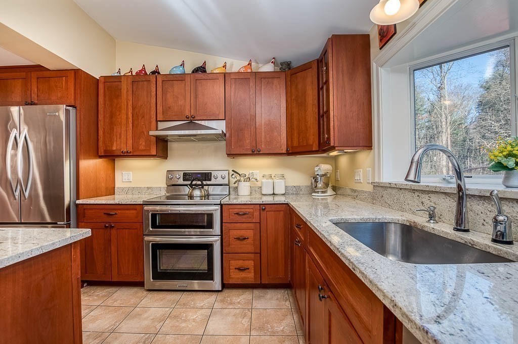 41 Millbrook Road Westwood, MA 02090 - Photo 8 of 42 a kitchen with granite countertop a stove sink and refrigerator