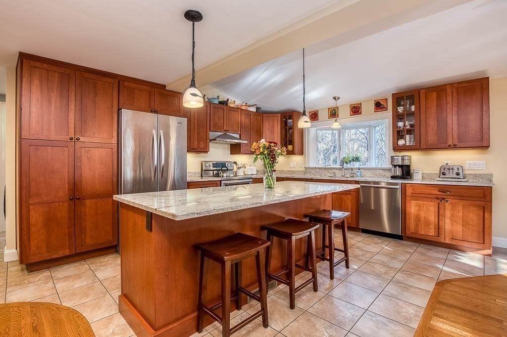 41 Millbrook Road Westwood, MA 02090 - Photo 9 of 42 a kitchen with stainless steel appliances granite countertop a stove a refrigerator a sink and dishwasher