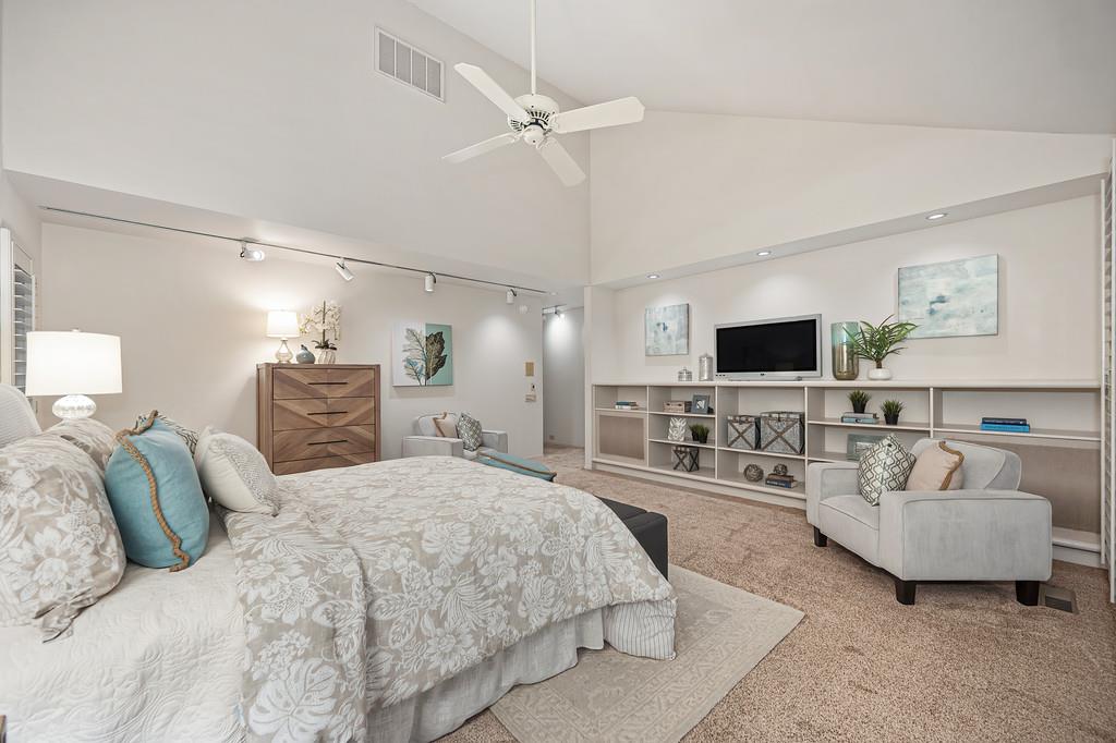 7650 Pineridge Road Fair Oaks, CA 95628 - Photo 25 of 67 a spacious bedroom with a bed and a flat screen tv