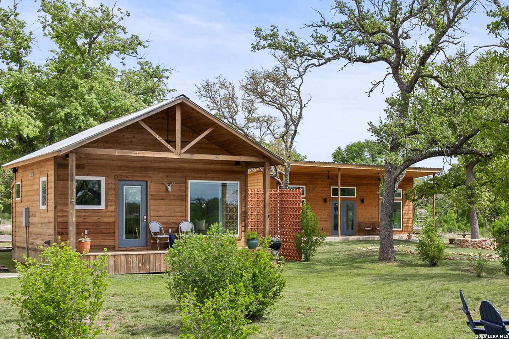 444-742 Klein Road Stonewall, TX 78671 - Photo 42 of 58 a front view of a house with a yard