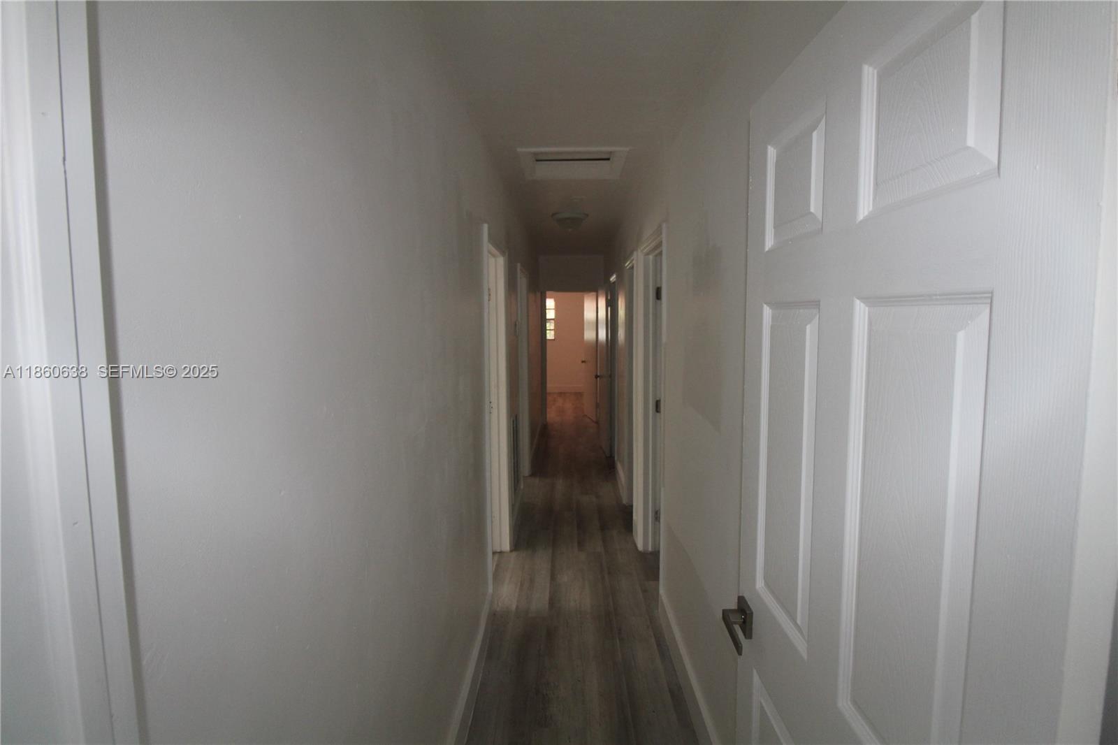965 West 23rd Street Hialeah, FL 33010 - Photo 11 of 16 a view of a bathroom from a hallway
