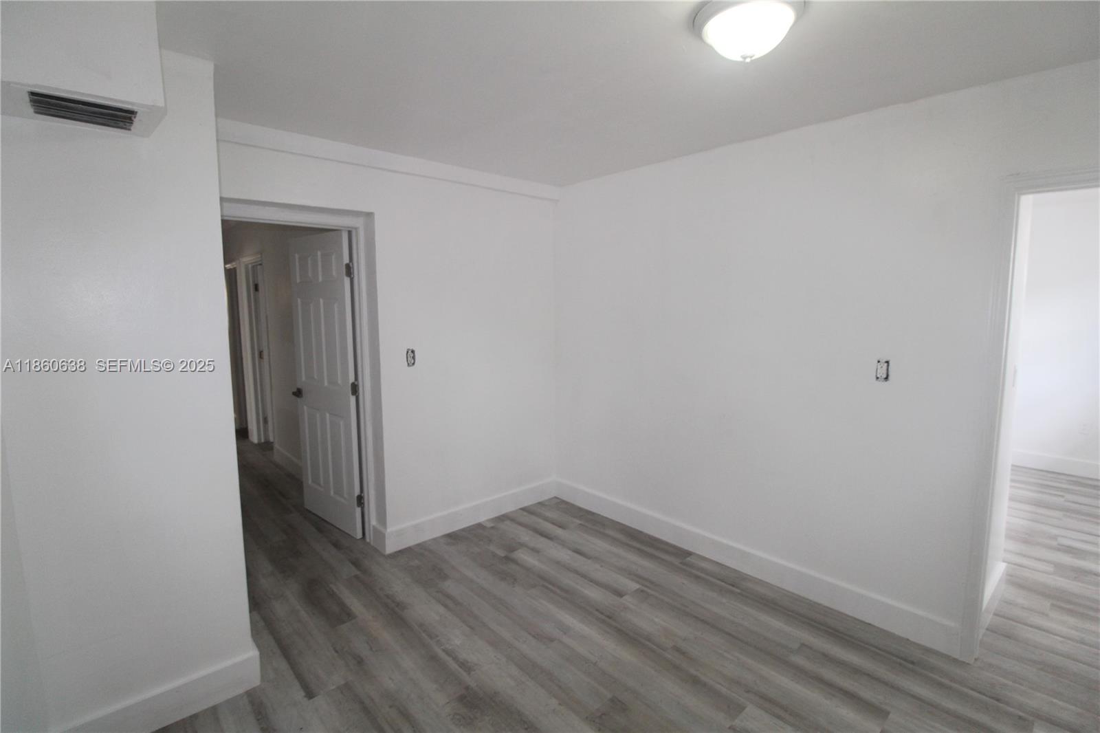 965 West 23rd Street Hialeah, FL 33010 - Photo 7 of 16 a view of small space with wooden floor